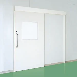 Pintu sliding berwarna putih merk uniflow pada area pabrik yang super higienis