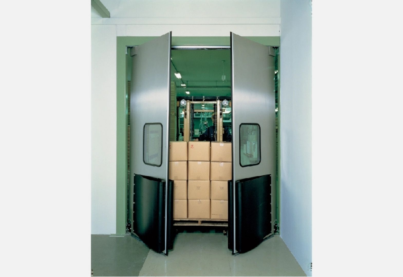 impact traffic door operating in warehouse area